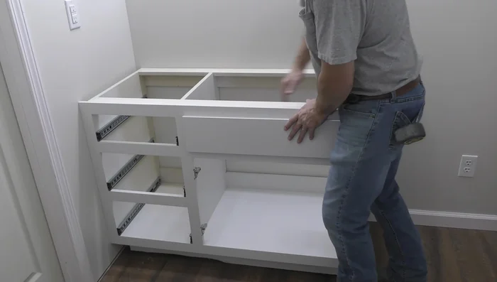 Install side splash and caulk seams.