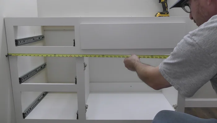 Install side splash and caulk seams.