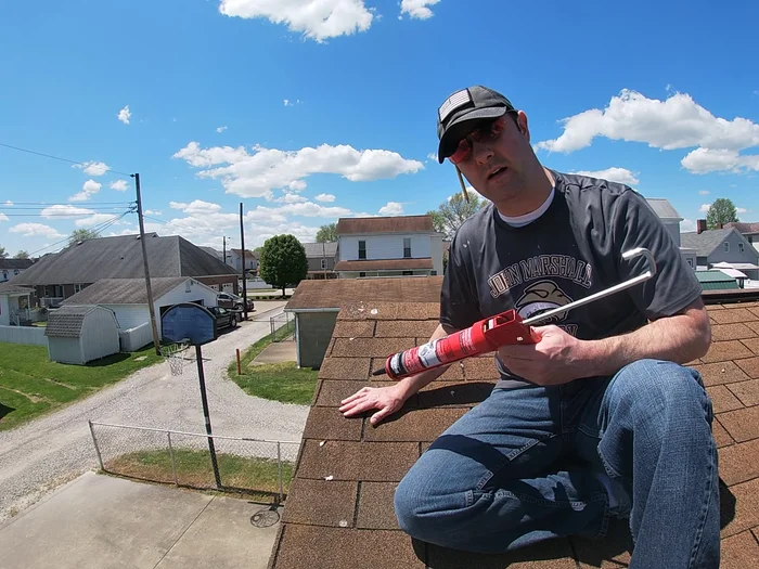 Press the shingle firmly back down onto the roof, ensuring good adhesion to the sealant and existing tar strip.