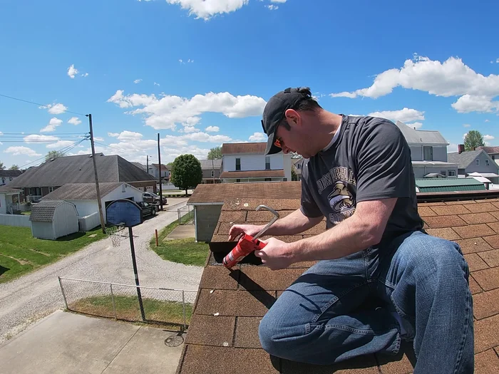 Press the shingle firmly back down onto the roof, ensuring good adhesion to the sealant and existing tar strip.