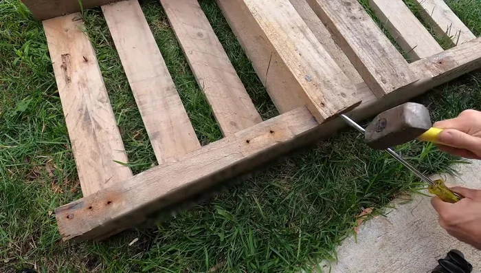 Reattach slats to both pallets.