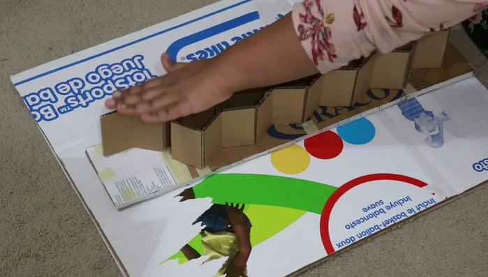 Add elevation (optional): Use additional cardboard or other materials to elevate the shelves.