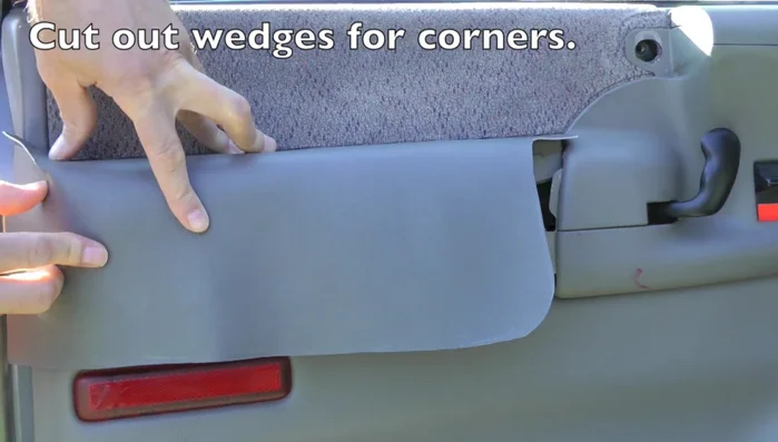 Cut wedges in the vinyl to allow for wrapping around corners.