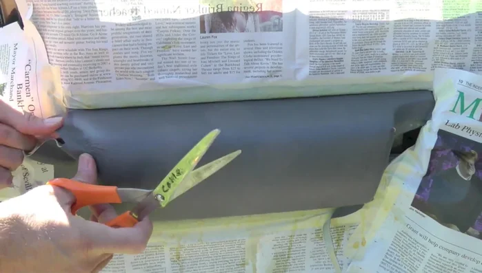 Wrap excess vinyl around to hide the seam at the top, trim and achieve a clean finish.