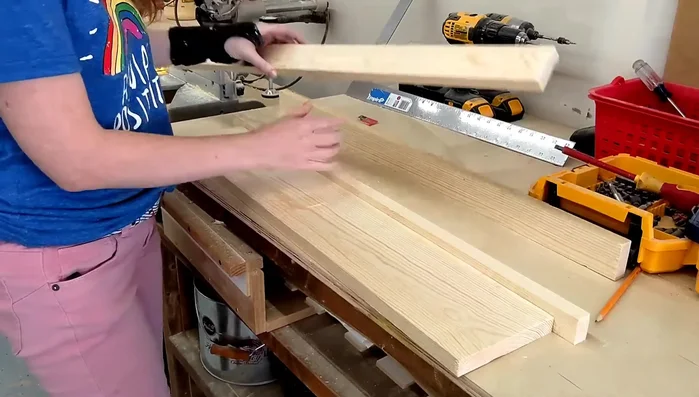 Create molding: Layer the smaller pieces on top of the 30-inch 1x6 to create a molding effect. Make a line on the smaller piece 3-4 inches from the ends for added layering.