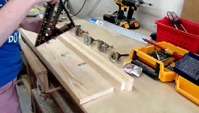 Create keyhole slots for hanging: Mark the keyhole slot positions and use a router to carve out the slots, slightly smaller than the brackets, then adjust with a chisel if needed. Also, rout a small hole in the center for screw placement.