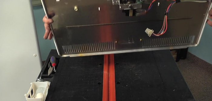 Remove the ground screw from the motor bracket.