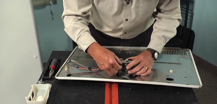 Remove the ground screw from the motor bracket.