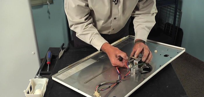 Remove the ground screw from the motor bracket.