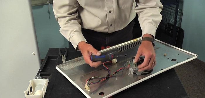 Remove the ground screw from the motor bracket.