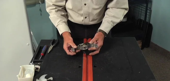 Remove the old motor, noting the rubber bushings.