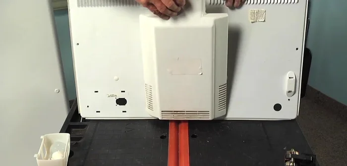 Reinstall the evaporator cover and screws.