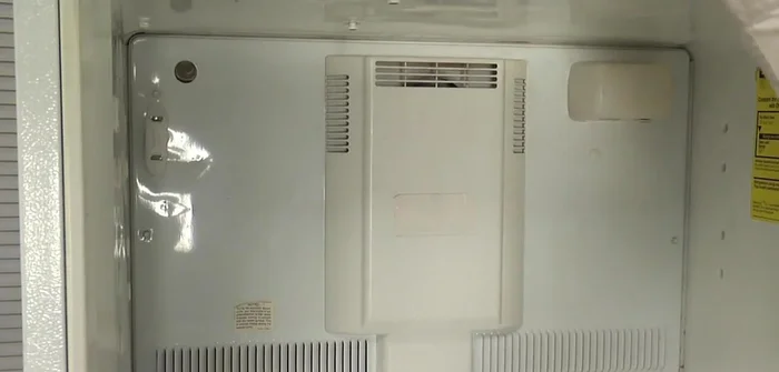 Disconnect the wires to the light bulb and the evaporator fan motor harness.