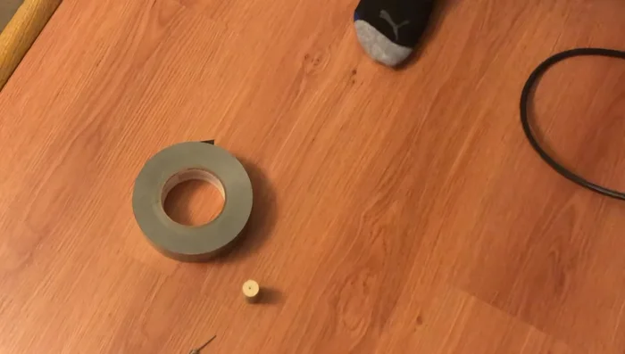 Insert the ball pin into the cork and connect it to the bike pump securely using clamps.