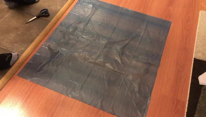 Tie all 15 parachute strings together into a single knot near the top.