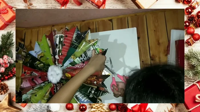 Make holes at the top, insert yarn, and tie to create a hanger.