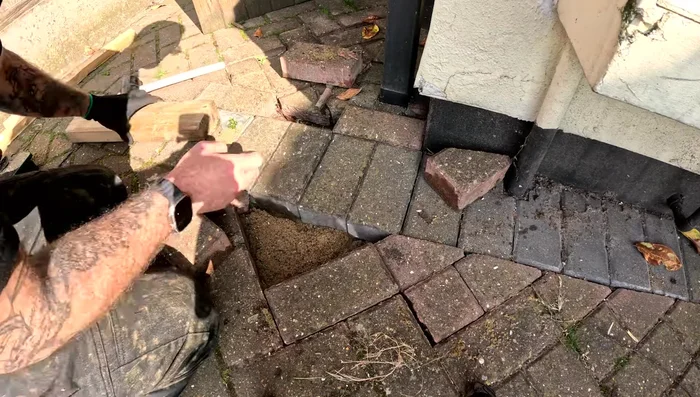 Ensure all blocks are secure and level to prevent further sinking.