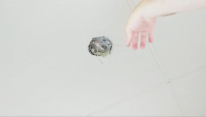 Install the mounting bracket. Use the screws from the old light fixture to attach the mounting bracket to the electrical box. Ensure the box is rated for the weight of the fan.