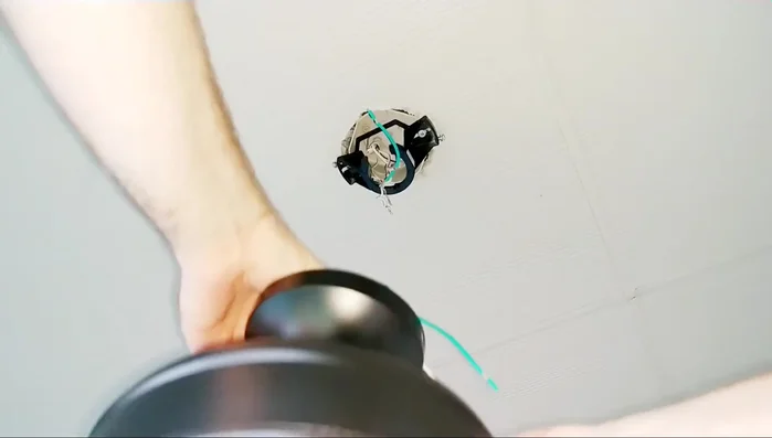 Secure the fan to the mounting bracket. Connect the ball-type mounting system provided with the fan, ensuring no wires are pinched.