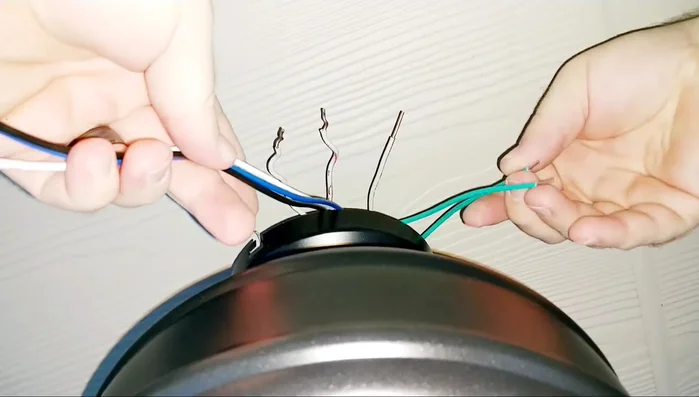 Prepare the fan wires. Strip insulation from the fan wires and cut away excess length.