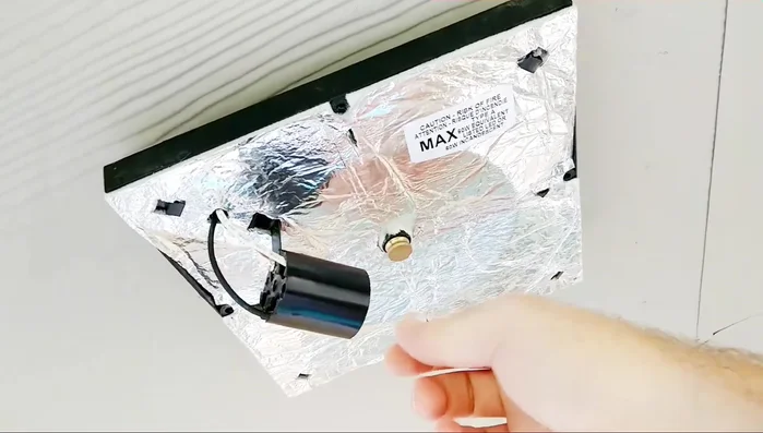 Remove the old light fixture. Unscrew the thumb screw and remove the screws holding the fixture.