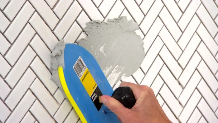 Tile the walls, using a light-colored grout to create a visual flow.