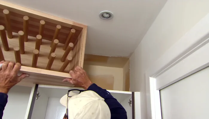 Install shelves on either side of the range hood to create visual continuity.