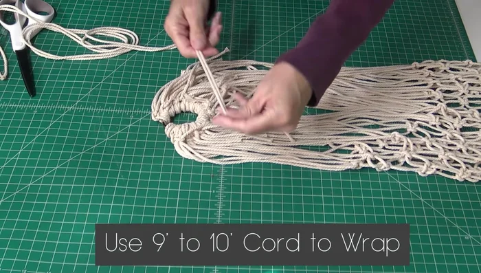 Create a noose using a 10-foot piece of cord and secure it to the ring, tucking in all the loose ends tightly.