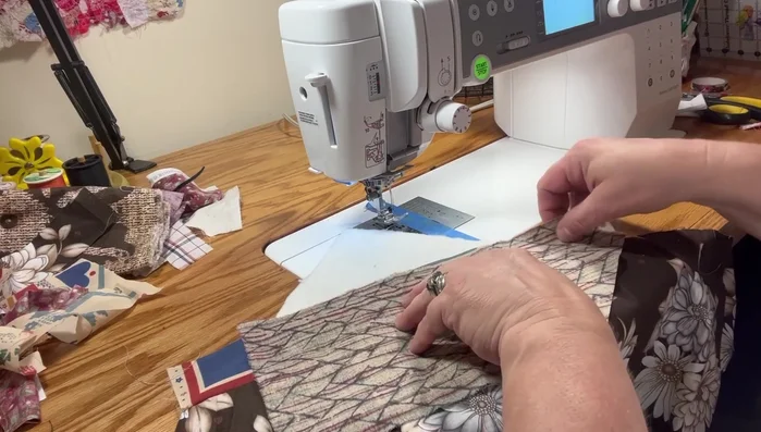 Repeat steps 3-5 for additional fabric pieces, maintaining the 1/2 inch border.