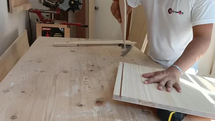 Ensure the wardrobe body is level before attaching it to the wall using screws.