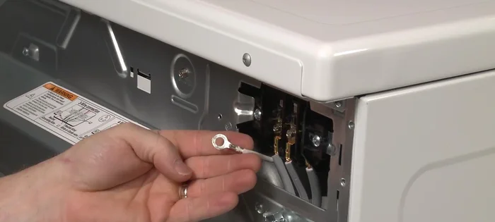 Tighten the strain relief screws to secure the power cord.
