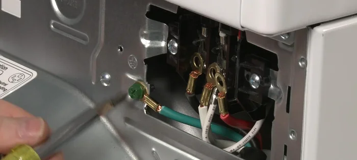 Remove the screw to release the grounding connection.