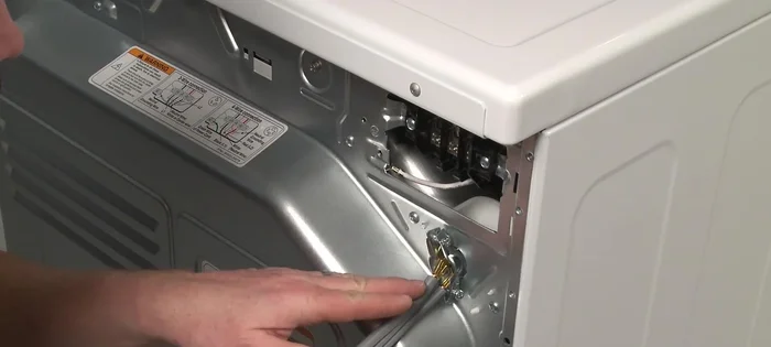 Tighten the strain relief screws to secure the power cord.