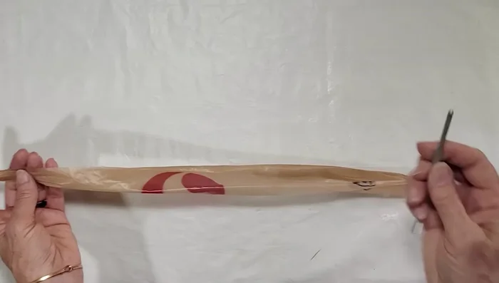 Flip the crochet hook and repeat the twisting process on the other end of the loop.