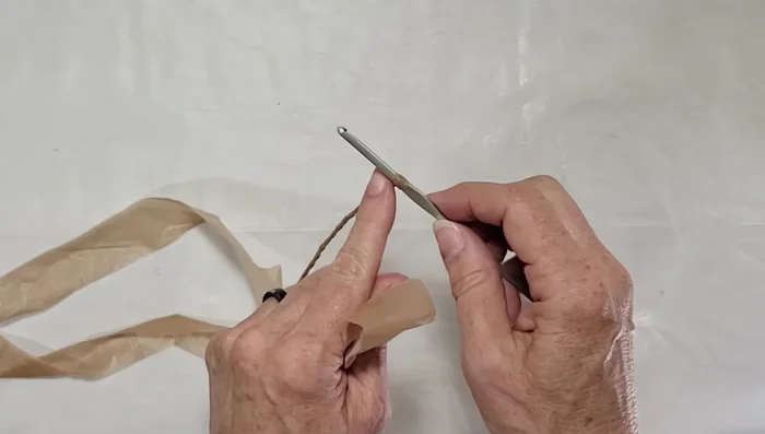 Continue adding strips and twisting until you reach the desired length.