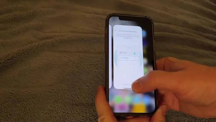 Go to your iPhone settings, find 'tp-link', and connect to the 'tp-link Smart plug' network.