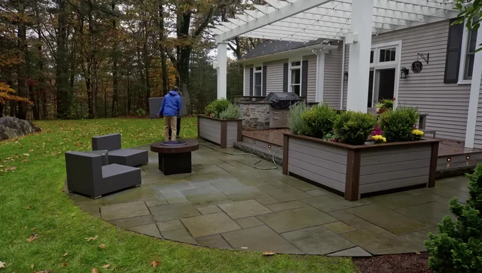 Hose down the patio and surrounding landscape to dilute the cleaner and protect vegetation.