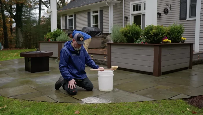 Rinse the patio with a hose.