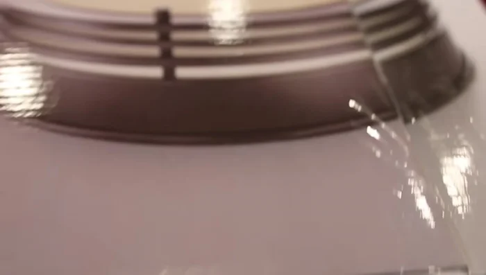 Create a bat light by modifying an inexpensive flush mount light fixture with a vinyl bat symbol (cut with a Cricut or by hand).