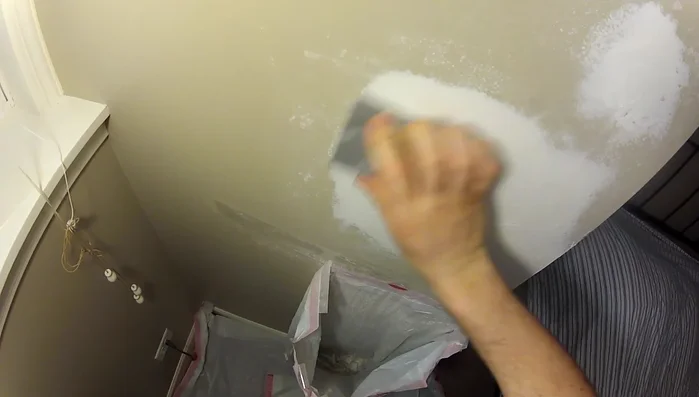 Sand the second layer smooth and remove any dust.