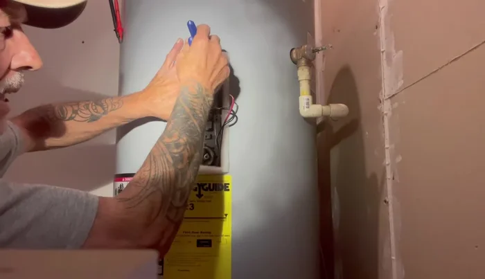 Set the temperature gauge on the thermostat to 120-125 degrees Fahrenheit.