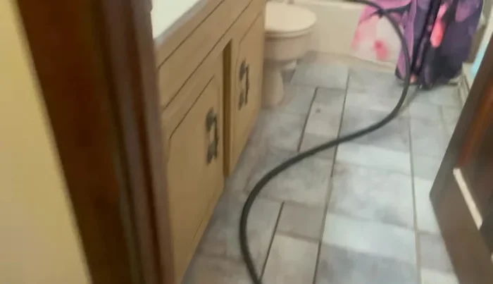 Turn off the water supply to the heater and drain the tank using a hose.