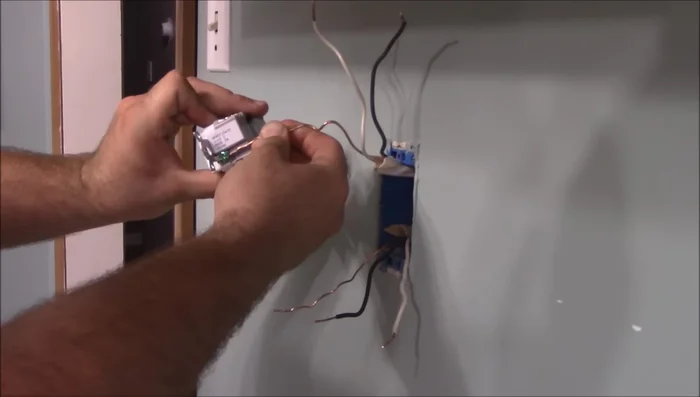 Connect the line and load wires to the GFCI outlet, ensuring hot wires go to the brass terminals and neutral wires to the silver terminals.