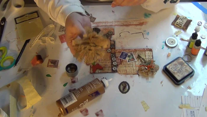 Add embellishments like flowers, keys, buttons, lace, stamps, and other decorative elements using tacky glue and hot glue where appropriate.