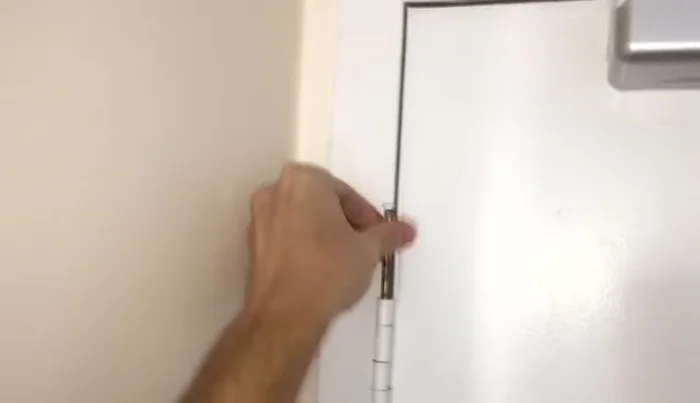 Remove the hinge pin: Use a nail and hammer (if needed) to knock out the pin holding the hinge together.