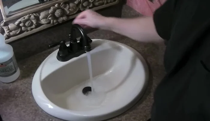 Test the drain to ensure no leaks.