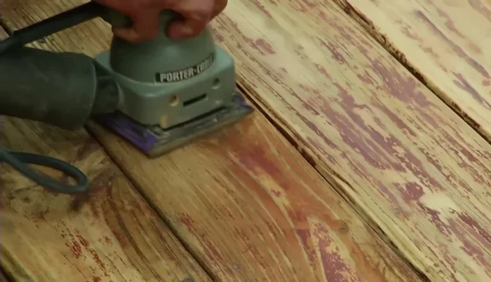 Remove stubborn stain spots with an orbital sander and 80 grit sandpaper. Sand handrails for smoothness.