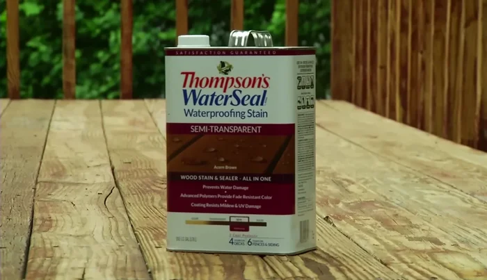 Use a narrow brush to coat the sides of the deck boards. For railings and vertical surfaces, apply sealer from bottom to top.