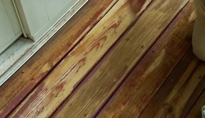 Use a narrow brush to coat the sides of the deck boards. For railings and vertical surfaces, apply sealer from bottom to top.