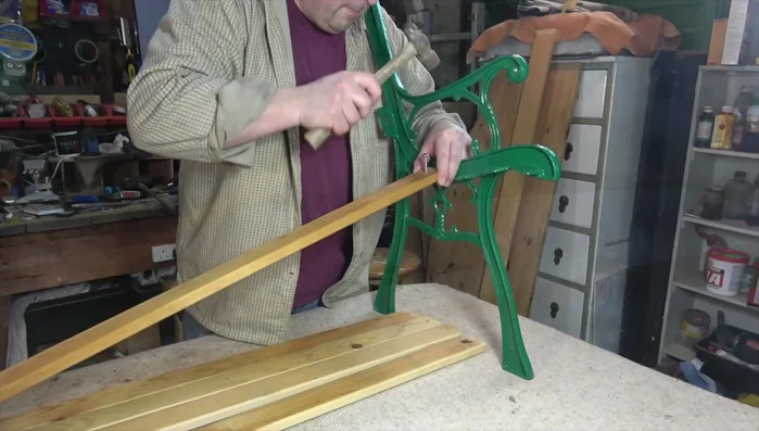 Attach the new seat slats to the metal ends using pre-drilled holes and bolts